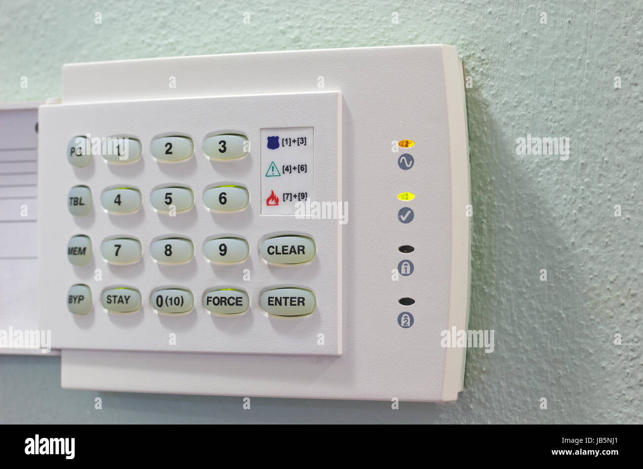 Security Appliances numeric keypad on the green wall Stock Photo Alamy