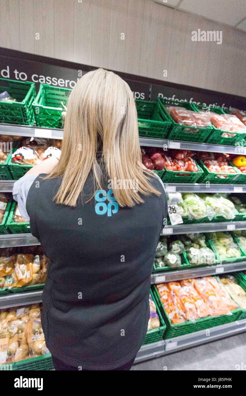 a female worker in a coop food store , england Stock Photo Alamy