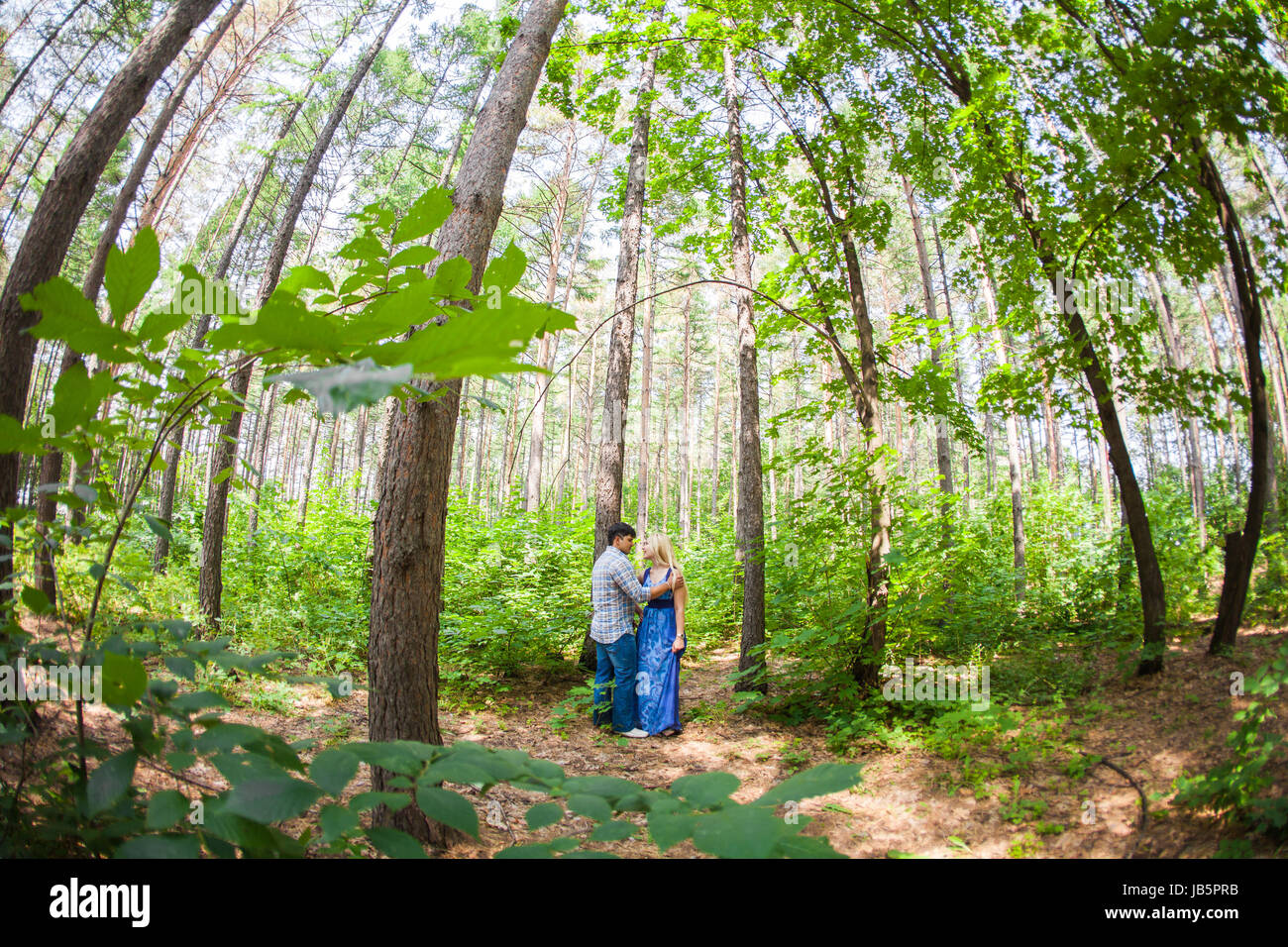 A young sweet couple in love on nature Stock Photo - Alamy