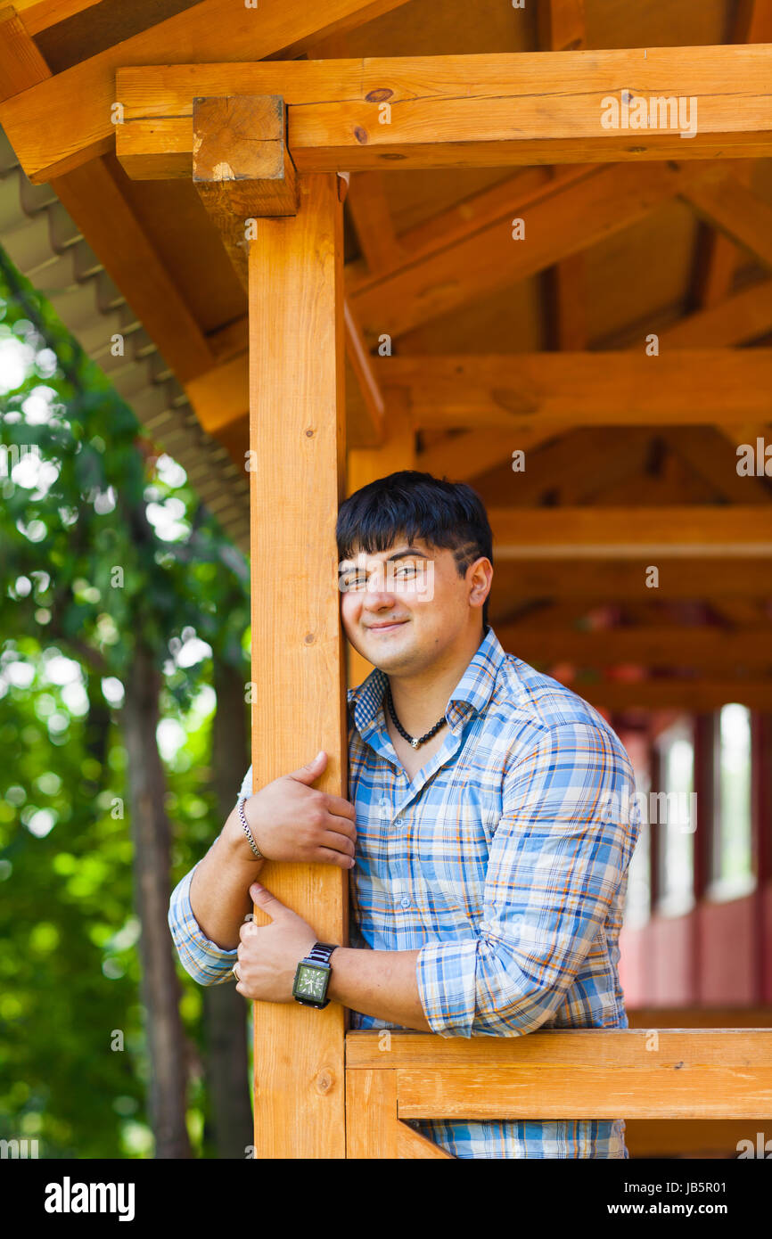 handsome mixed race young man smiling outdoors Stock Photo Alamy