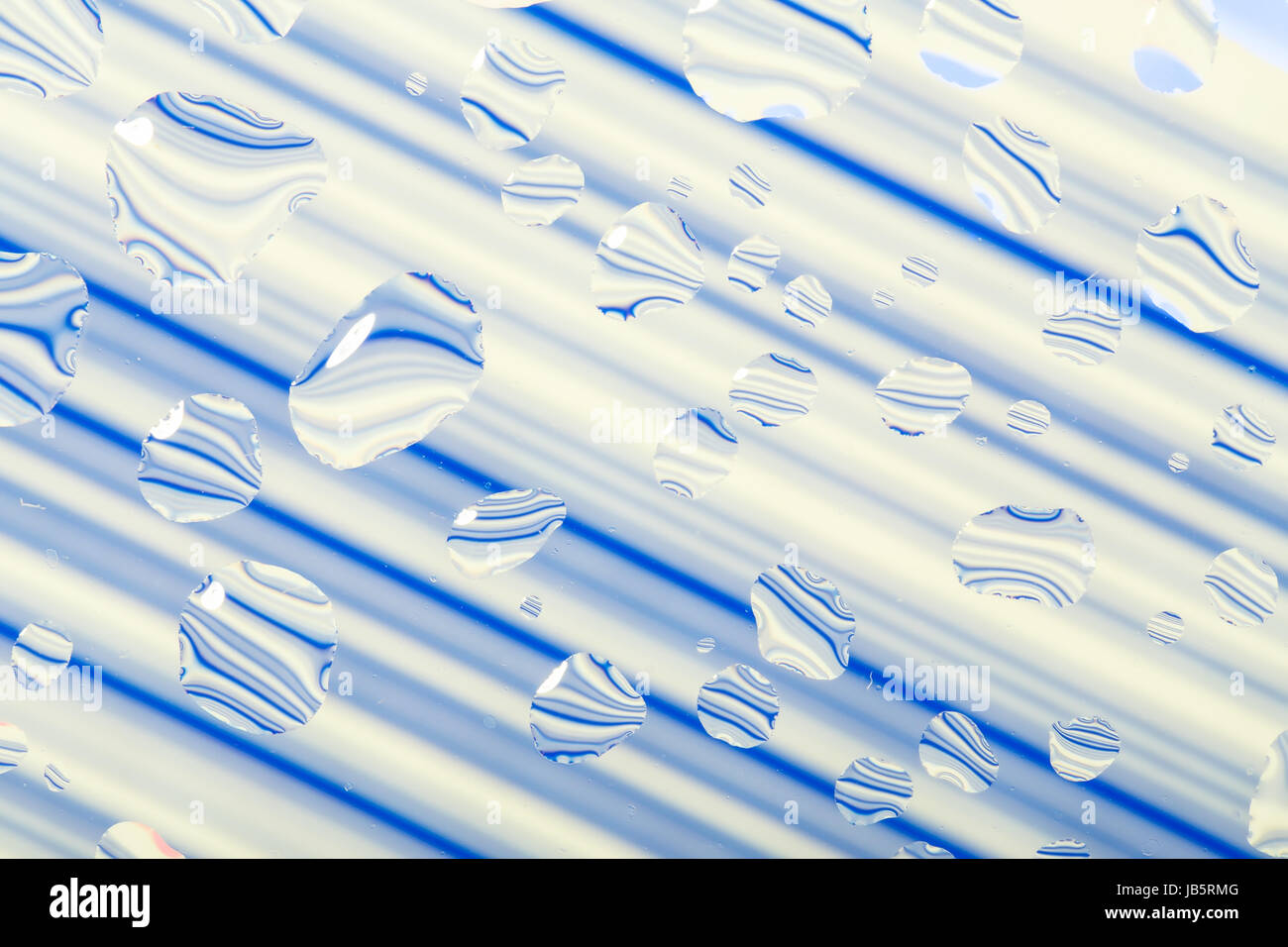 blue abstract background with water drops on glass Stock Photo - Alamy