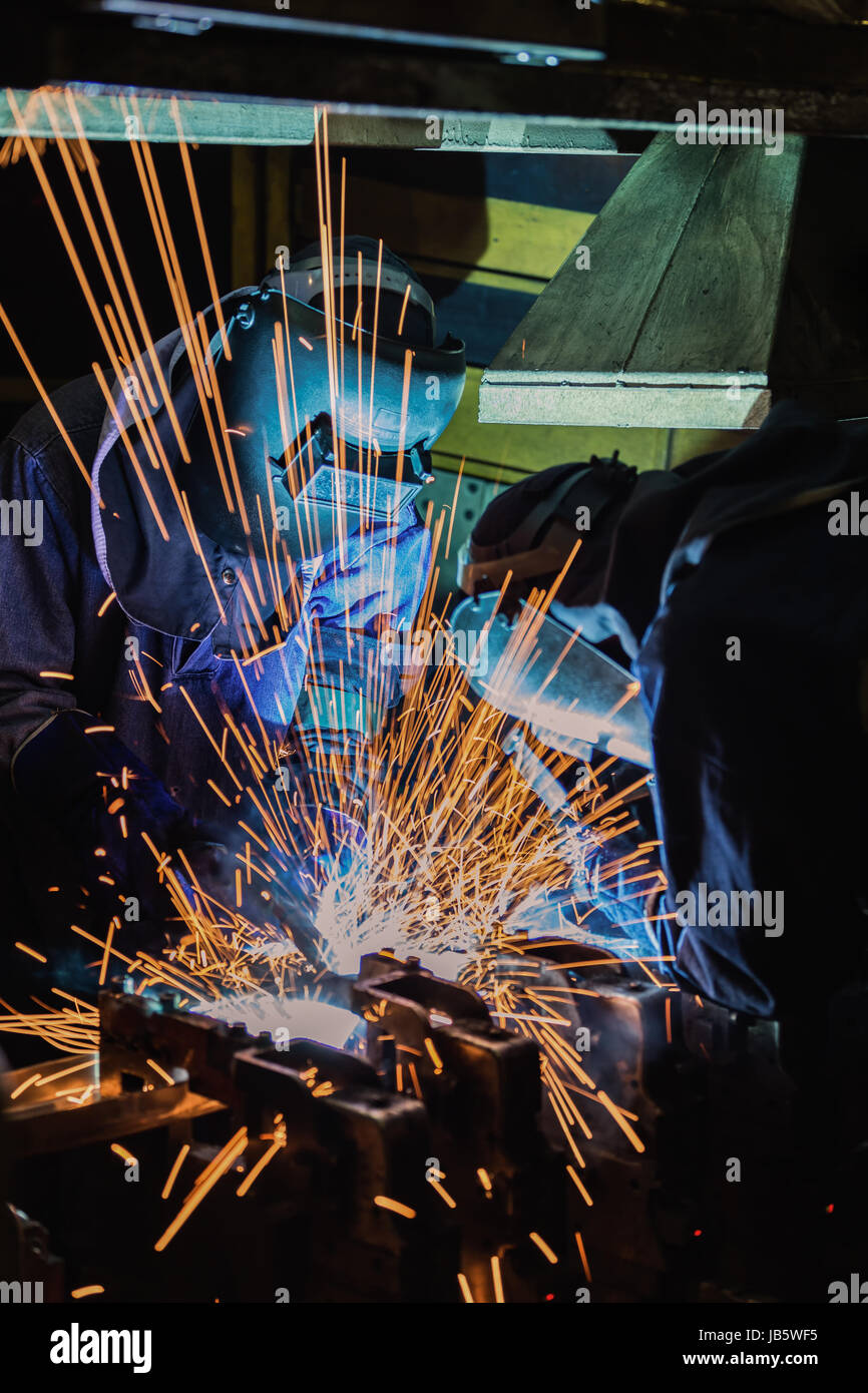 Welder is welding automotive part Stock Photo