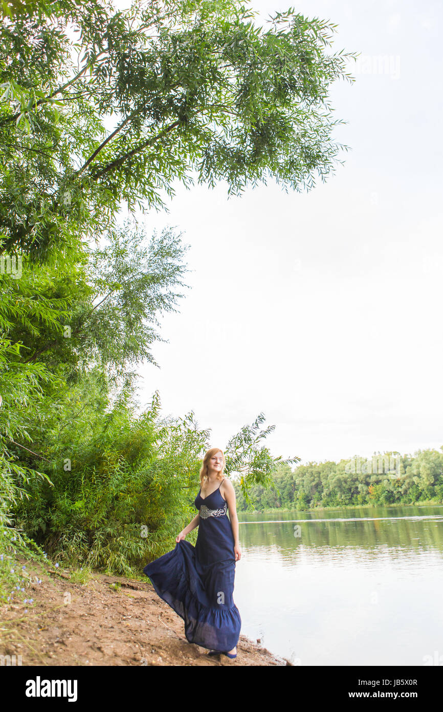beautiful girl in dress on the river outdoor Stock Photo - Alamy