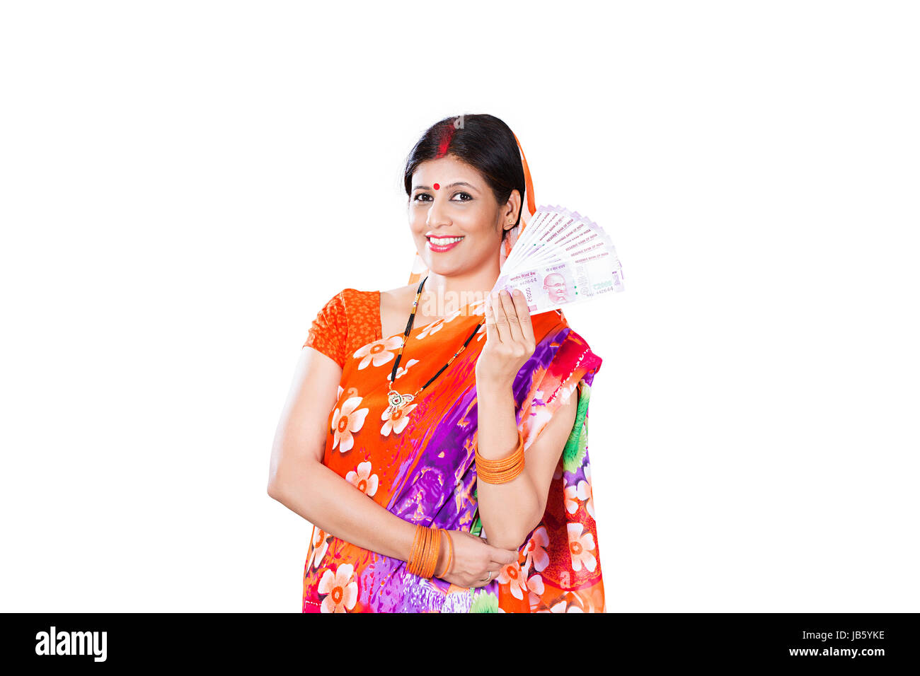 Studio shot Of 1 Indian Rural woman showing Rupees Notes On White Background Stock Photo