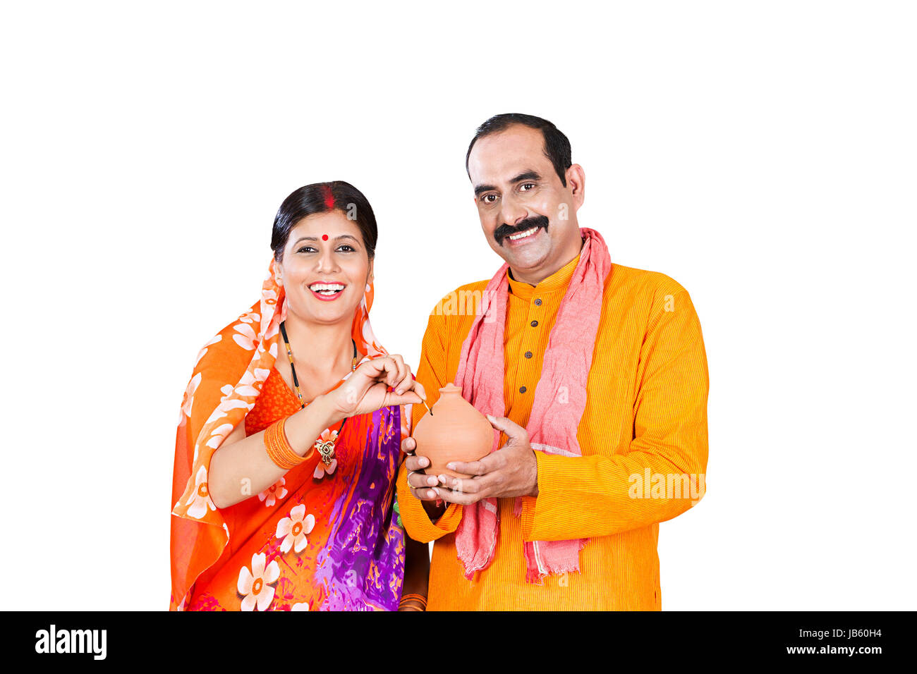 Happy 2 Indian Rural Married Couple Inserting Coin Piggy Bank Saving ...