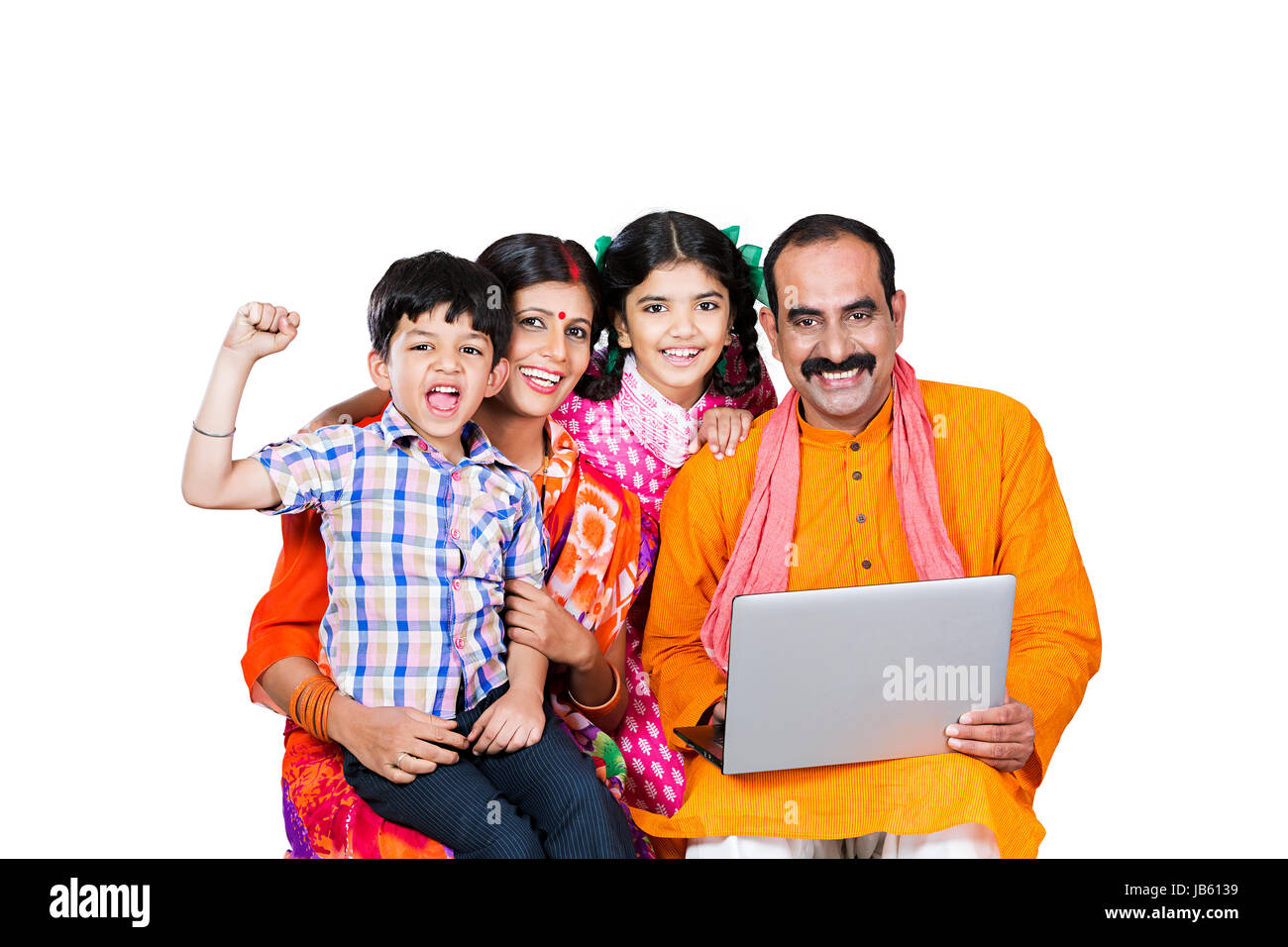 Happy Indian Rural Parents And 2 Children Sitting Together And Using Laptop Successful Education Learn Stock Photo