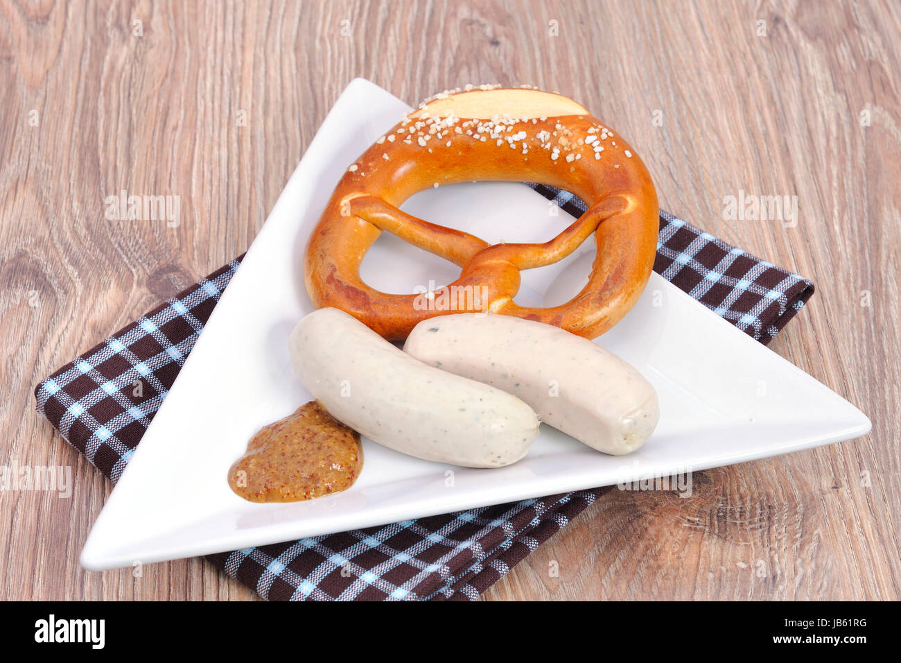 veal sausage with pretzel Stock Photo Alamy