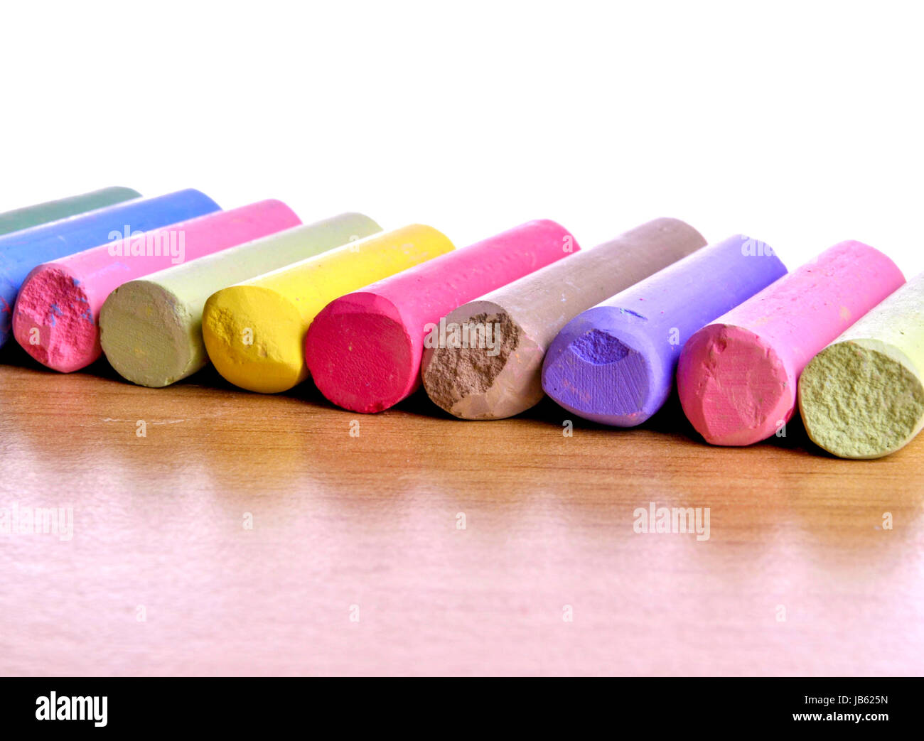 many colored crayons arranged in a row Stock Photo Alamy