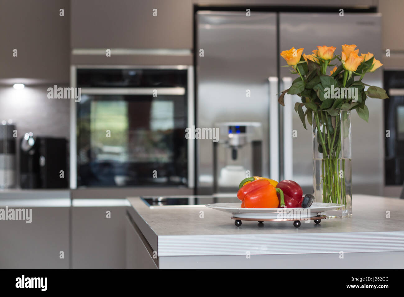 Lifestyle photo of a modern grey kitchen interior Stock Photo - Alamy