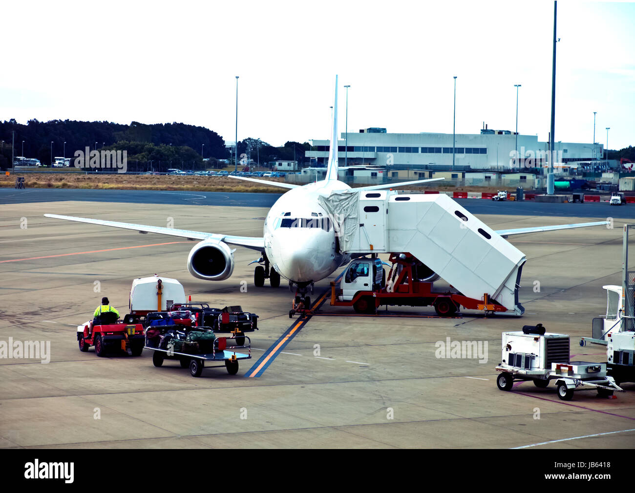 Aircraft being prepared for departure with luggage to be loaded at Brisbane Airport Stock Photo
