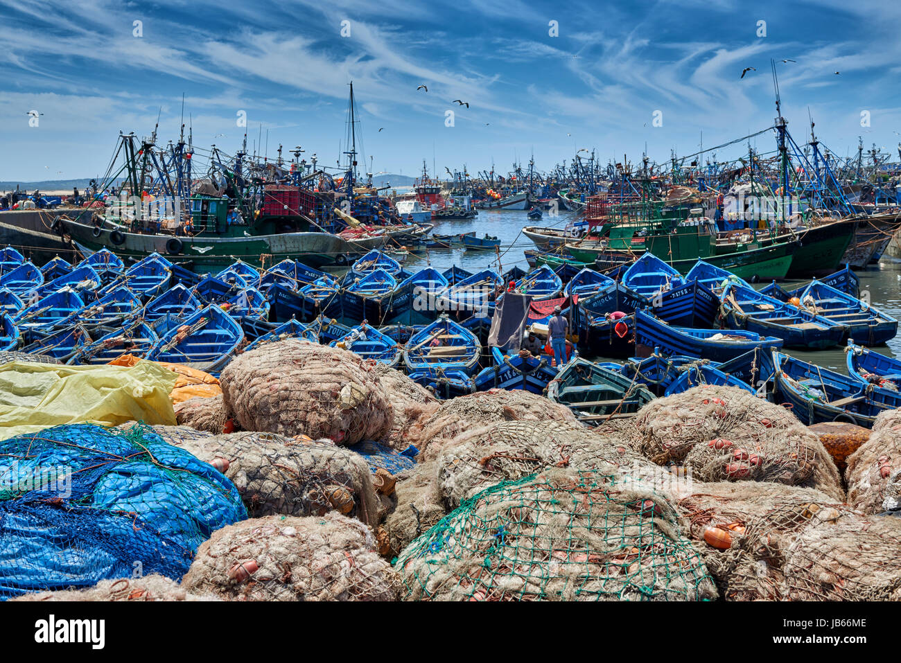 fishing nets and rowing fishing boats in harbor of Essaouira, UNESCO world heritage site, Essaouira, Morocco, Africa Stock Photo