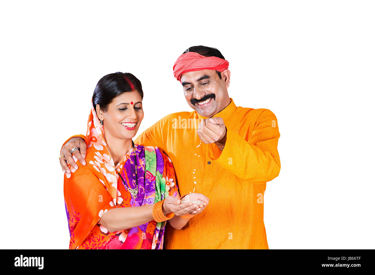 2 Indian Rural farmer Couple Holding wheat in his hand Falling Wheat Purity Quality Stock Photo