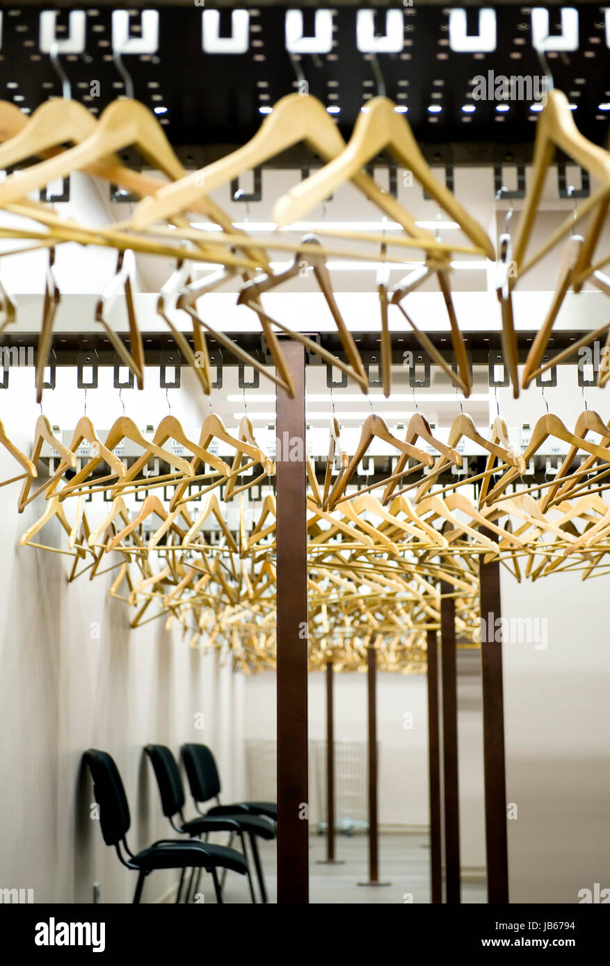 Lot of hangers in a cloakroom Stock Photo Alamy