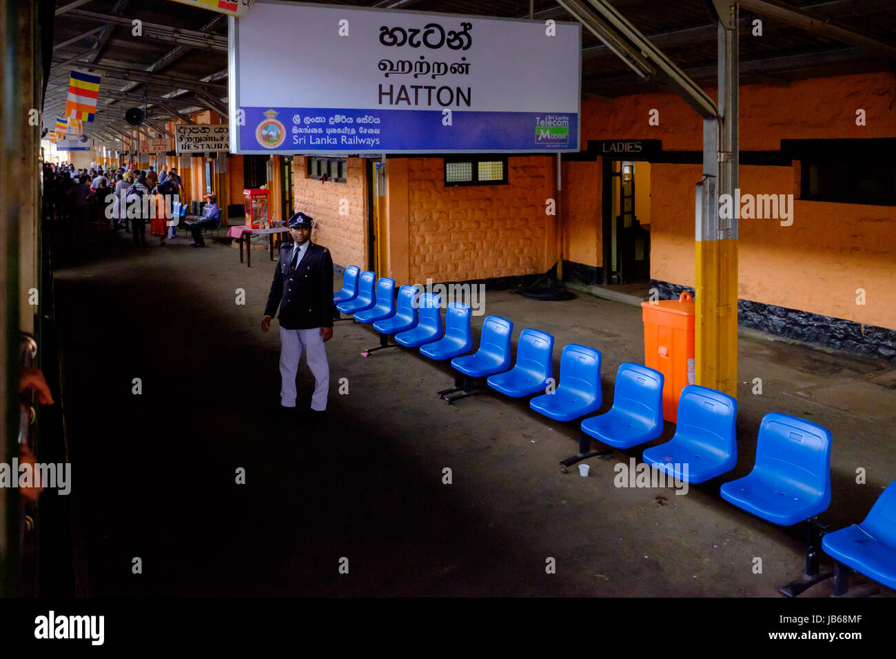 Hatton Station - in the hill country, Sri Lanka. Note the smartly dressed train guard! Stock Photo
