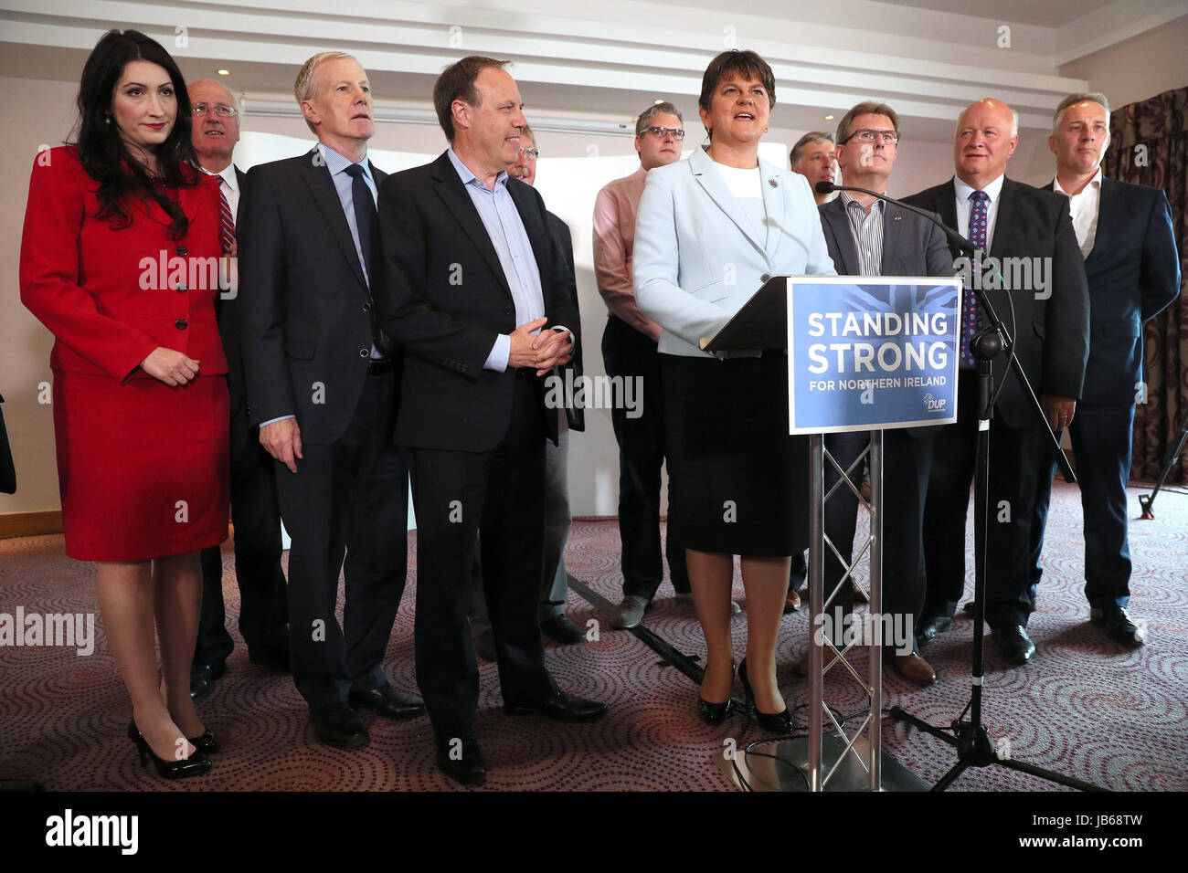 DUP leader Arlene Foster (centre right) with MP's at the Stormont Hotel in Belfast after Prime Minister Theresa May has announced that she will work with 'friends and allies' in the DUP to enable her to lead a government. Stock Photo