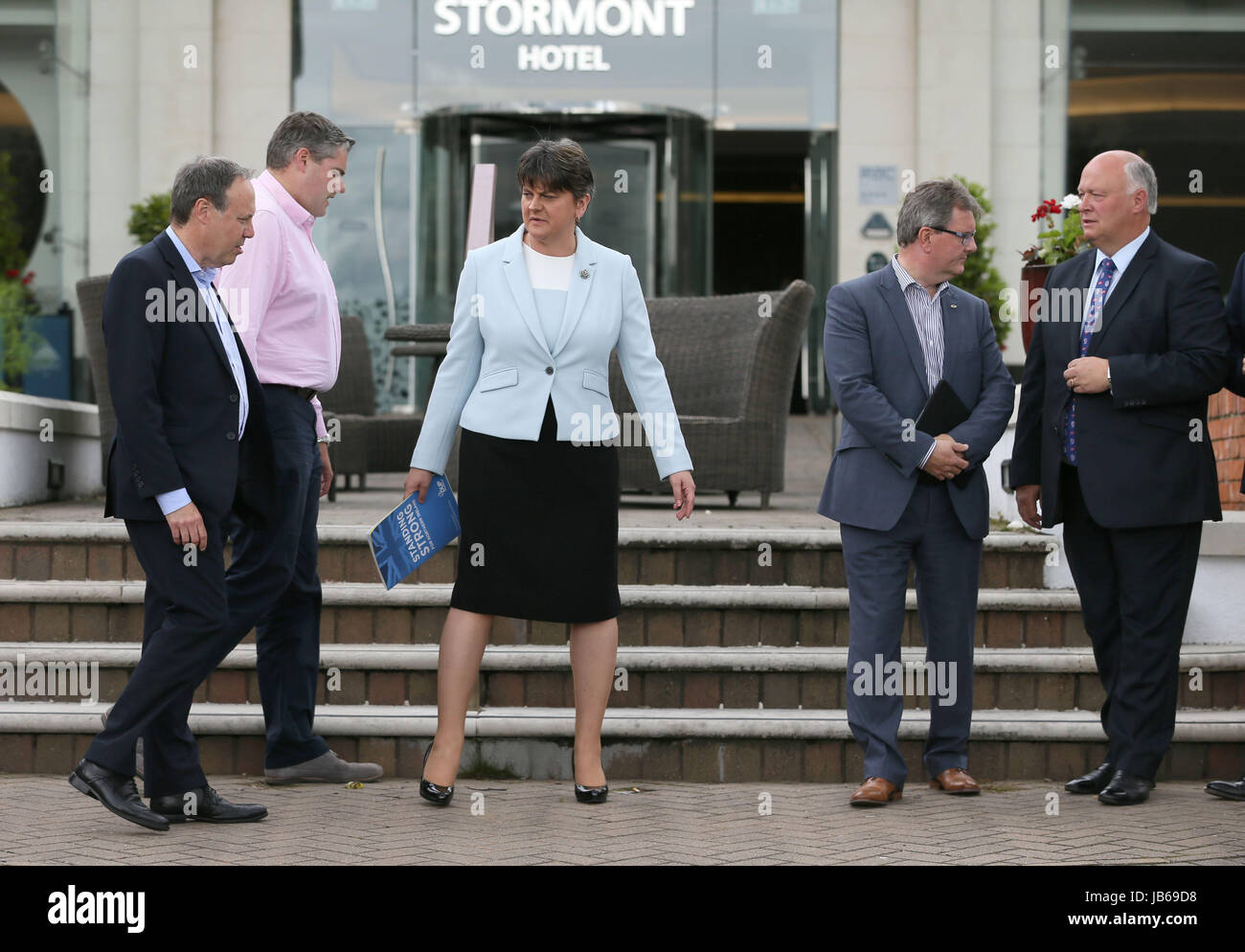 DUP leader Arlene Foster (centre) with MP's at the Stormont Hotel in Belfast after Prime Minister Theresa May has announced that she will work with friends and allies in the DUP to enable her to lead a government. Stock Photo