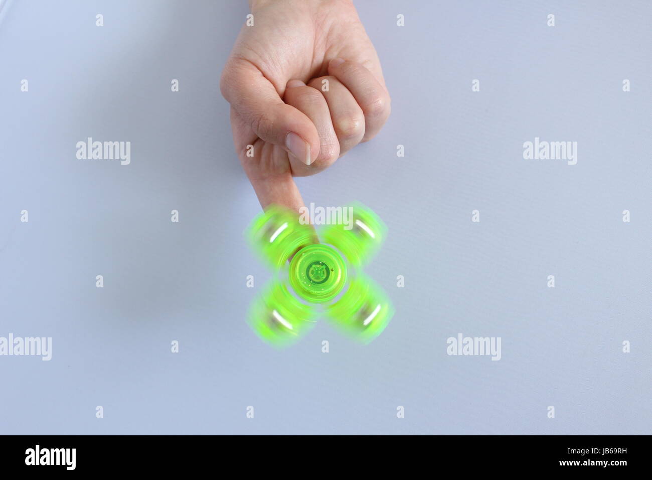 Toy stress Fidget spinner hand for child and adult colorful Stock Photo