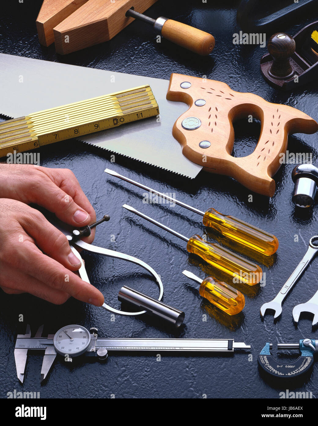 Hand Tools With a Pair of Hands Stock Photo