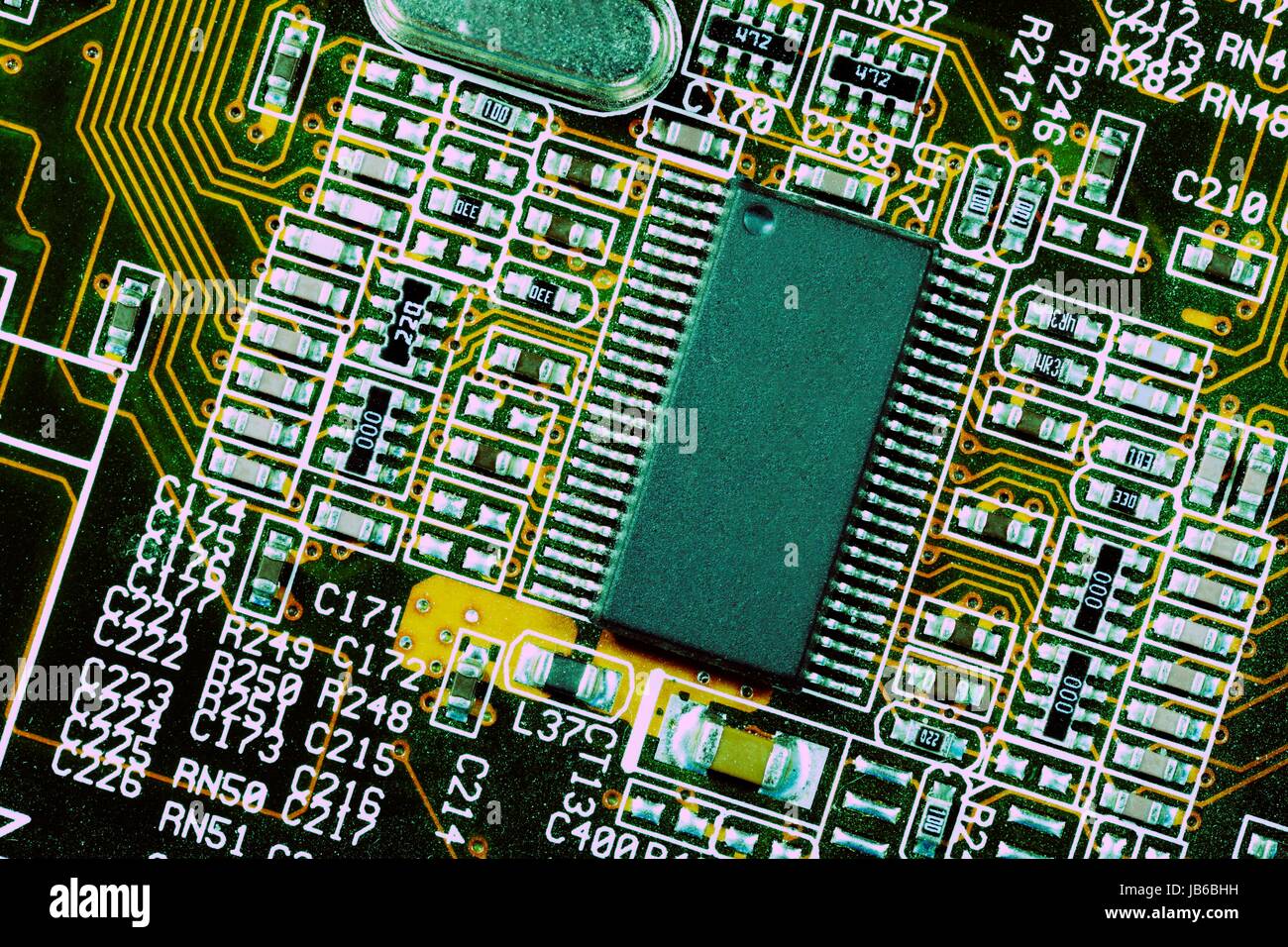 Computer mother board with microchips and electrodes. Stock Photo