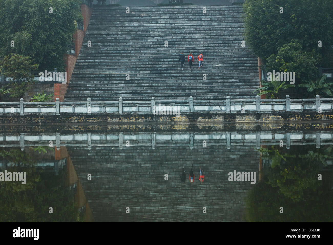 Tourists on giant stairway Bai Dinh Buddist Temple Complex, near Ninh Binh, Vietnam Stock Photo