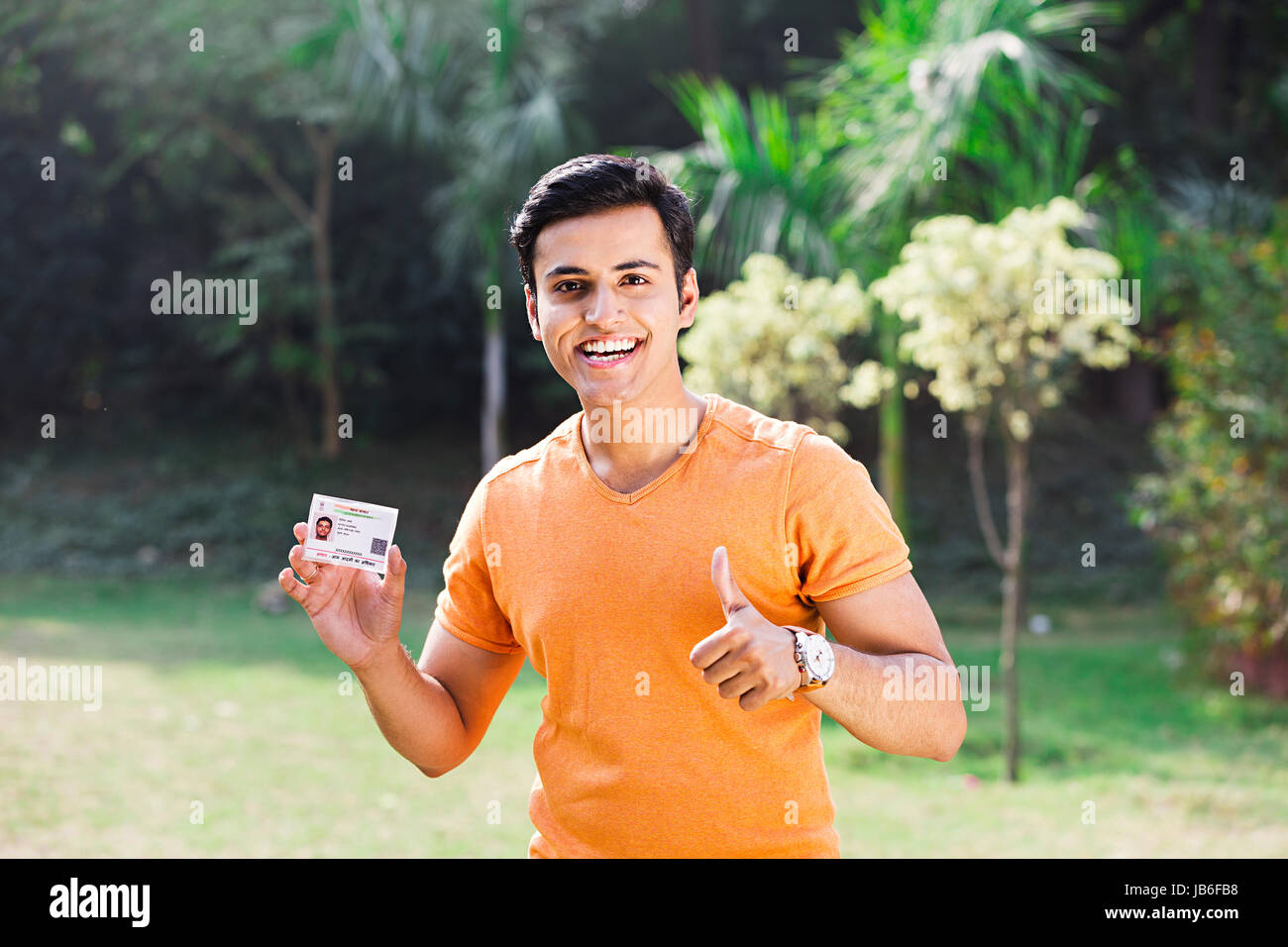 1 Indian Teeanger Boy Showing Thumbs up With Aadhaar Card Government Identity Stock Photo