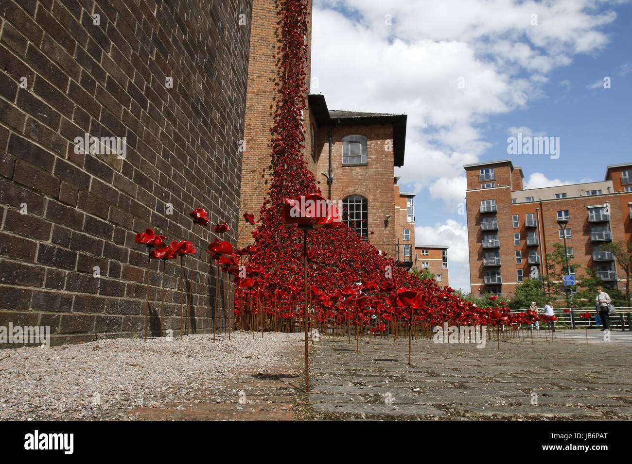 London, UK. 9th Jun, 2017. First full public display of the Weeping Window poppy display at Derby Silk Mill Tower. The display is made up of several thousand of the ceramic flowers created by Derbyshire's Paul Cummins and formed part of the magnificent Blood Swept Lands and Seas of Red exhibition at the Tower of London in 2014. Derby, UK. 9th June 2017. Credit: Richard Holmes/Alamy Live News Stock Photo