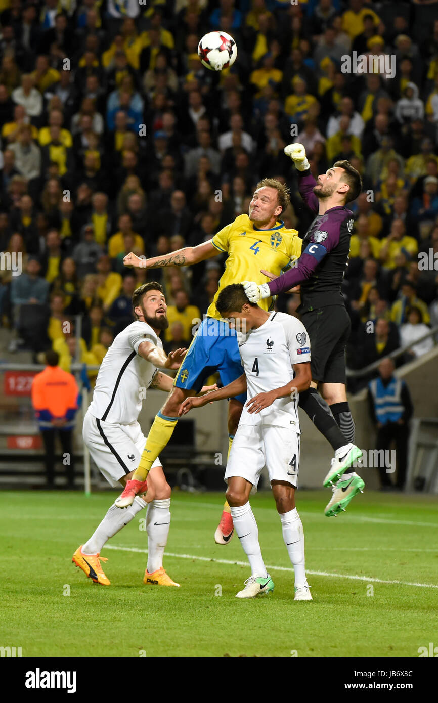 Stockholm, Sweden. 9th june, 2017. France goalkeeper 1 Hugo Lloris on the boll whit Sweden 4 Andreas Granqvist in the qualifying game between Sweden and France. Credit: Johan Schefstrom/Frilansfotograferna/Alamy Live News Stock Photo