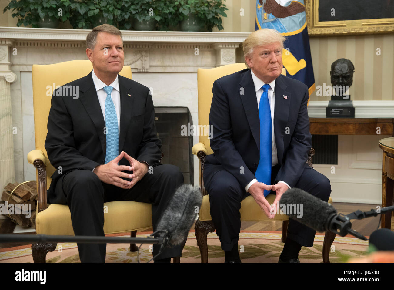 US President Donald J. Trump (R) and President of Romania Klaus Iohannis (L) meet in the Oval Office of the White House, in Washington, DC, USA, 09 June 2017. Credit: Michael Reynolds/Pool via CNP /MediaPunch Stock Photo
