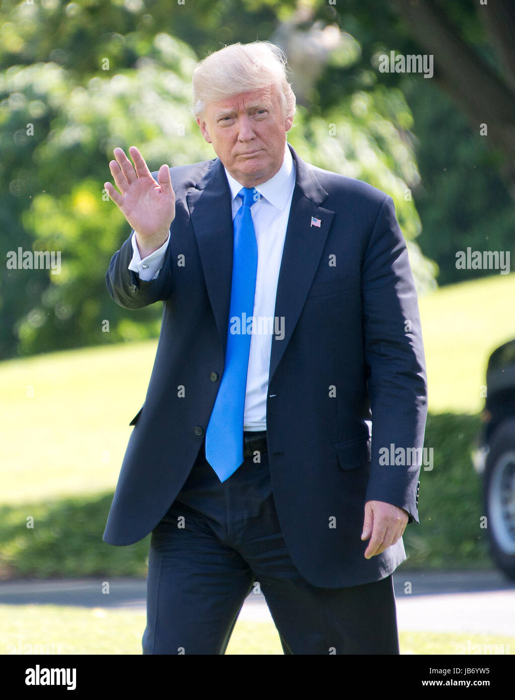 United States President Donald J. Trump waves to the press as he walks to Marine One on the South Lawn of the White House in Washington, DC on Friday, June 9, 2017. The President will be spending the weekend at his resort in Bedminster, New Jersey. Credit: Ron Sachs/CNP /MediaPunch Stock Photo