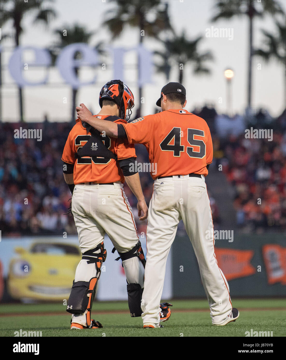 San Francisco, California, USA. 09th June, 2017. San Francisco Giants catcher Buster Posey (28) visits starting pitcher Matt Moore (45) on the mound in the fourth inning of a MLB baseball game between the Minnesota Twins and the San Francisco Giants on Portuguese Heritage Night at AT&T Park in San Francisco, California. Valerie Shoaps/CSM/Alamy Live News Stock Photo