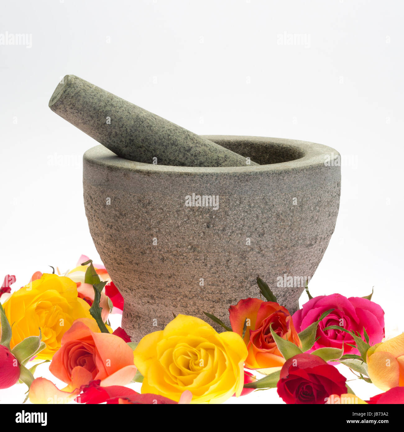 mortar with stösel stone in rose petals Stock Photo