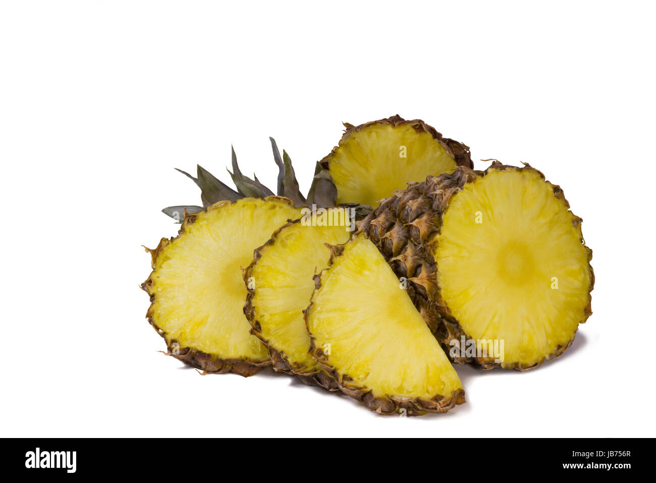 Sliced pineapple and slices of pineapple. Photographed on a white background. Stock Photo