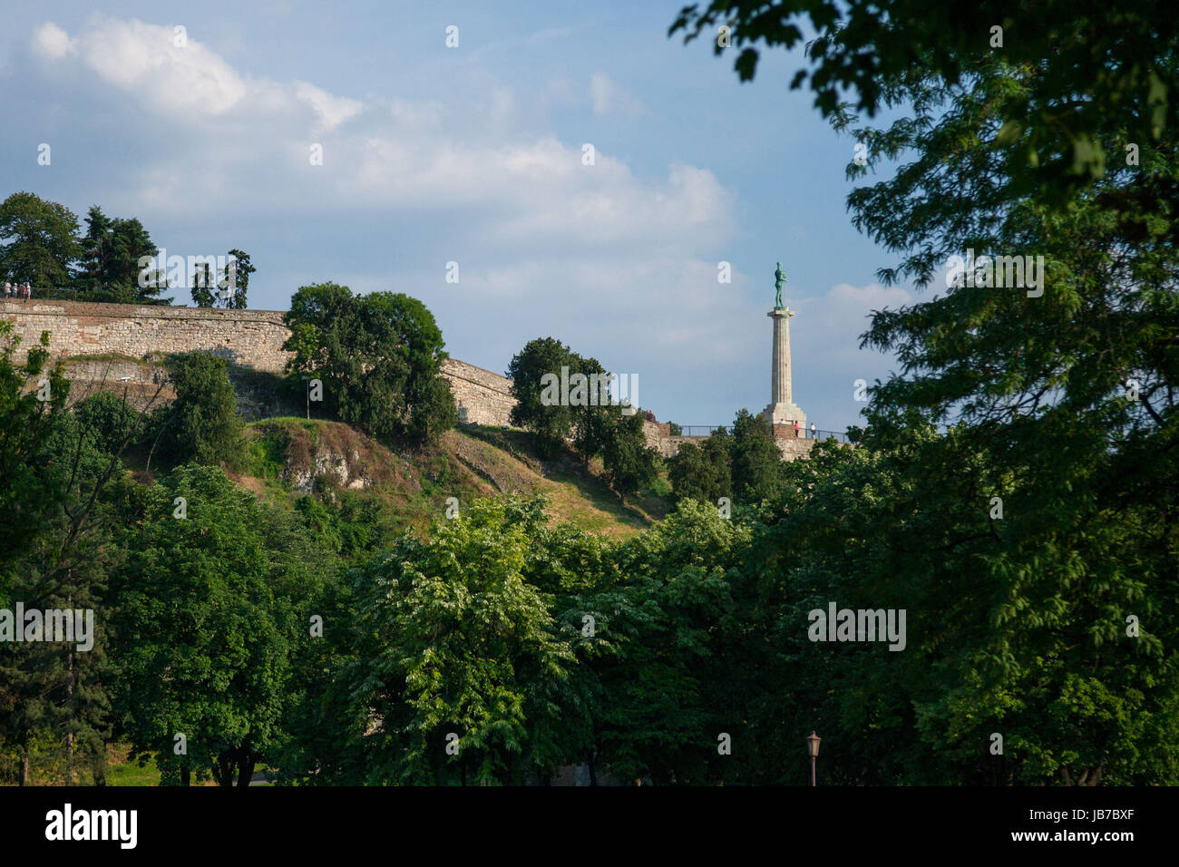 Victor statue on Kalemegdan fortress seen from the bottom in Belgrade, Serbia   Picture of the iconic victory statue seen on Belgrade's fortress, Kale Stock Photo