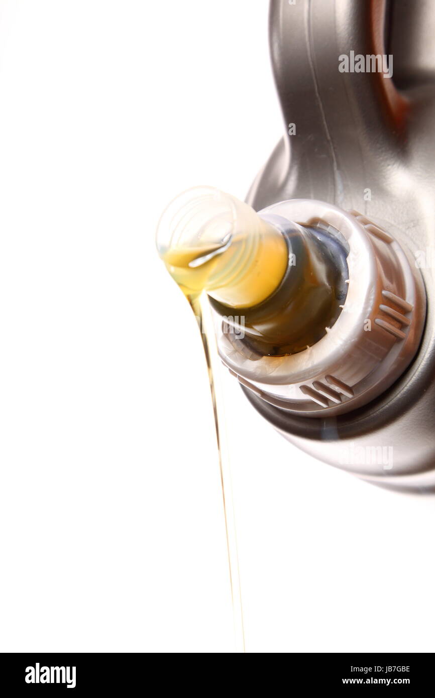 Can with car engine oil pouring in front white background Stock Photo