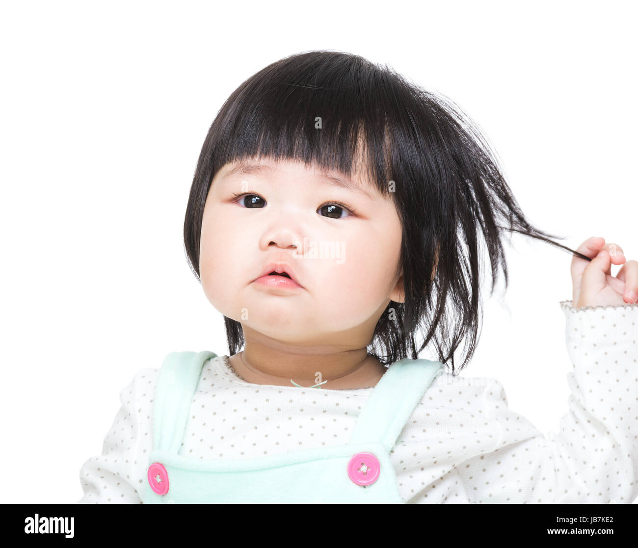 Asian baby girl touch hair Stock Photo - Alamy