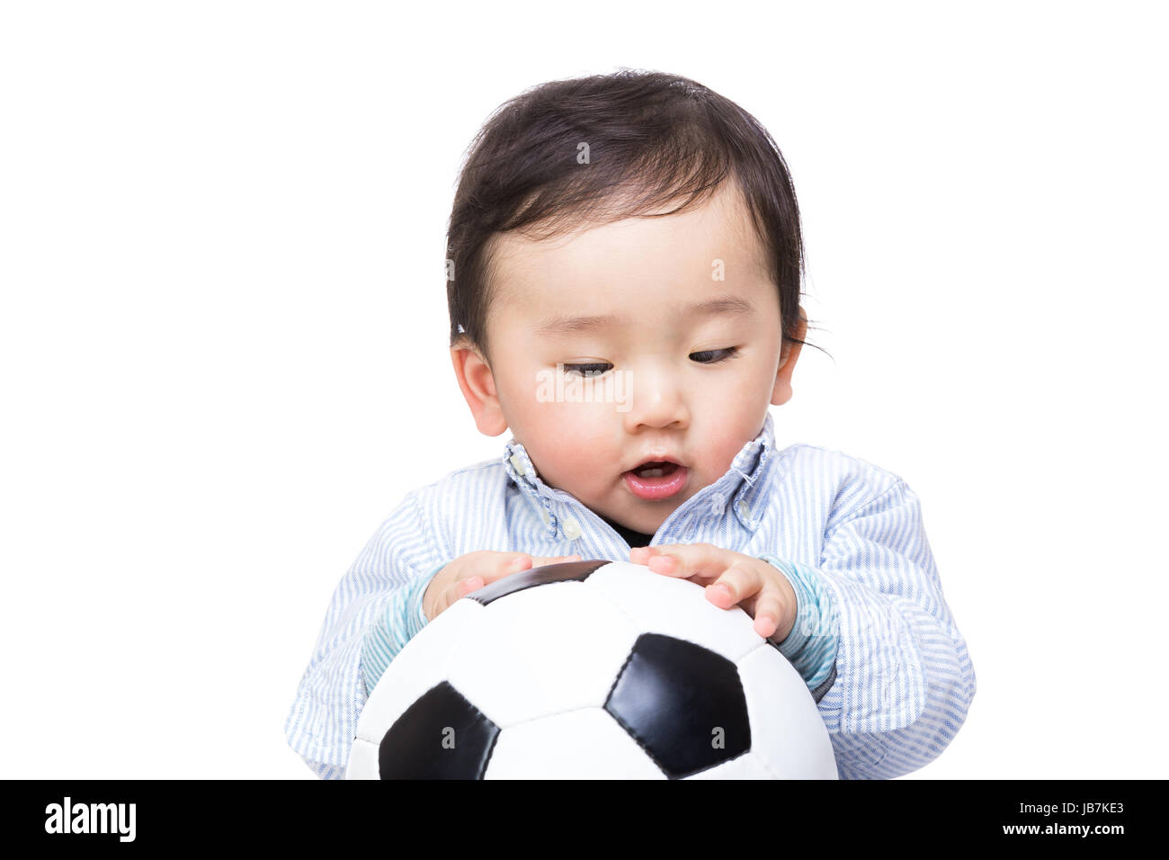 Asiab baby boy lloking at soccer ball Stock Photo Alamy