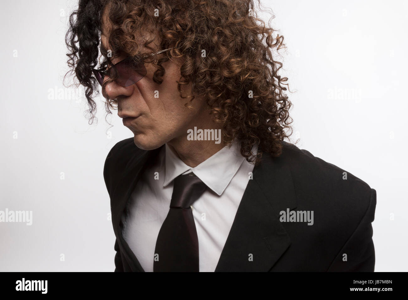 Cropped Portrait Of Mediterranean Looking Man With Curly Hair
