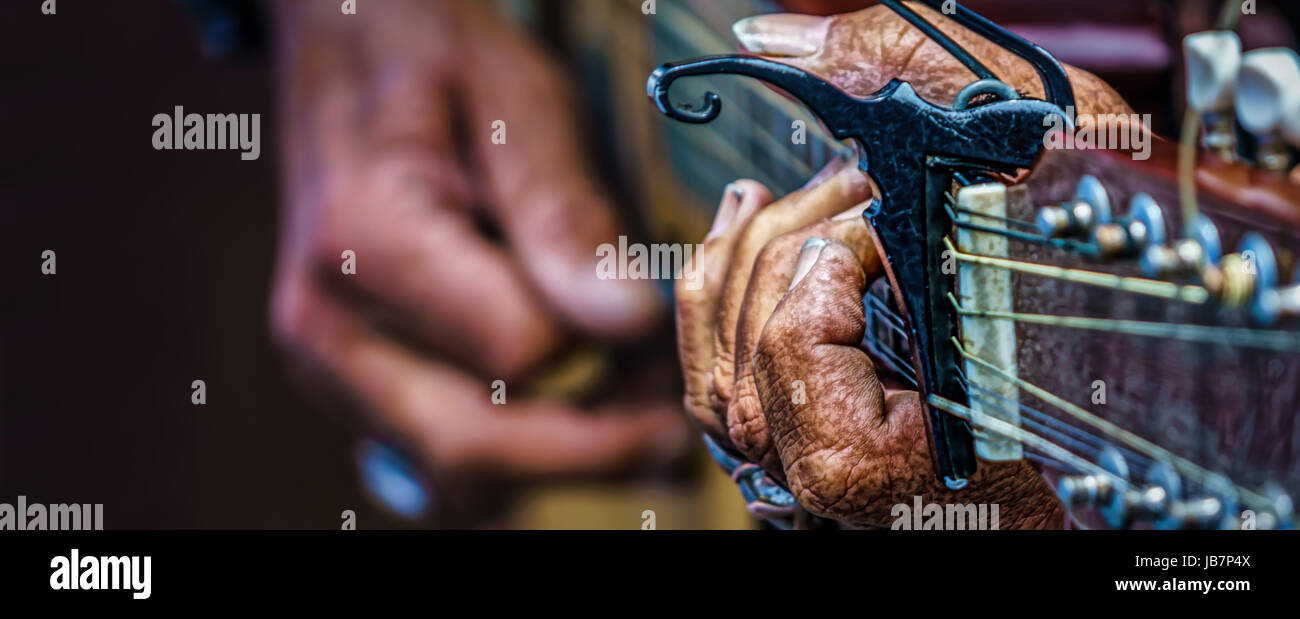 The rough hands of a street musician in southern California. Stock Photo