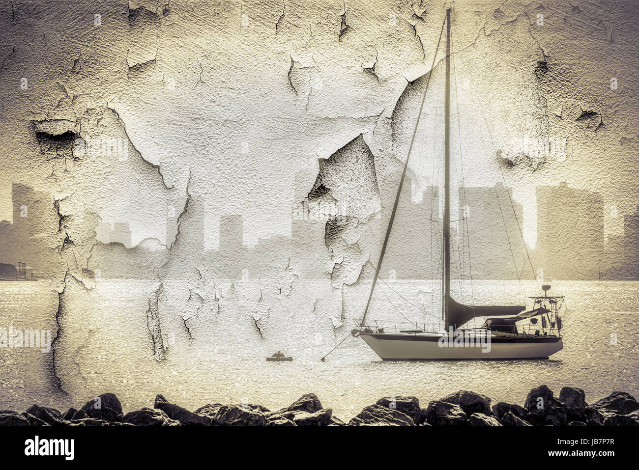 A weathered wall with the image of a sailboat in San Diego, CA. Stock Photo