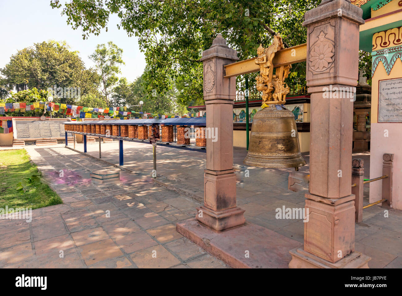Buddhist Prayer Flags and Buddhist Prayer Wheels near Mulagandhakutie Vihara Temple near Sarnath,India,Asia Stock Photo