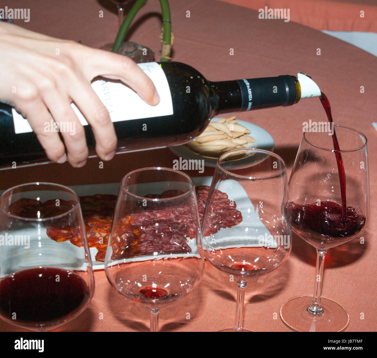 Serving red wine in glasses Stock Photo Alamy