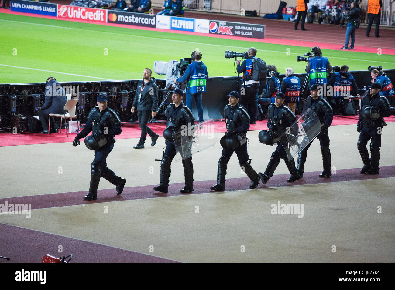 Swat and police intervention during a soccer sport event, when a supporter threw a smoke bomb Stock Photo