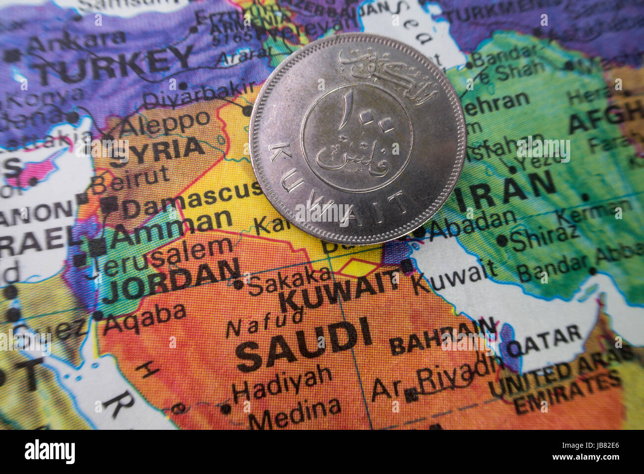Kuwait Coin on World Map Still Life Stock Photo