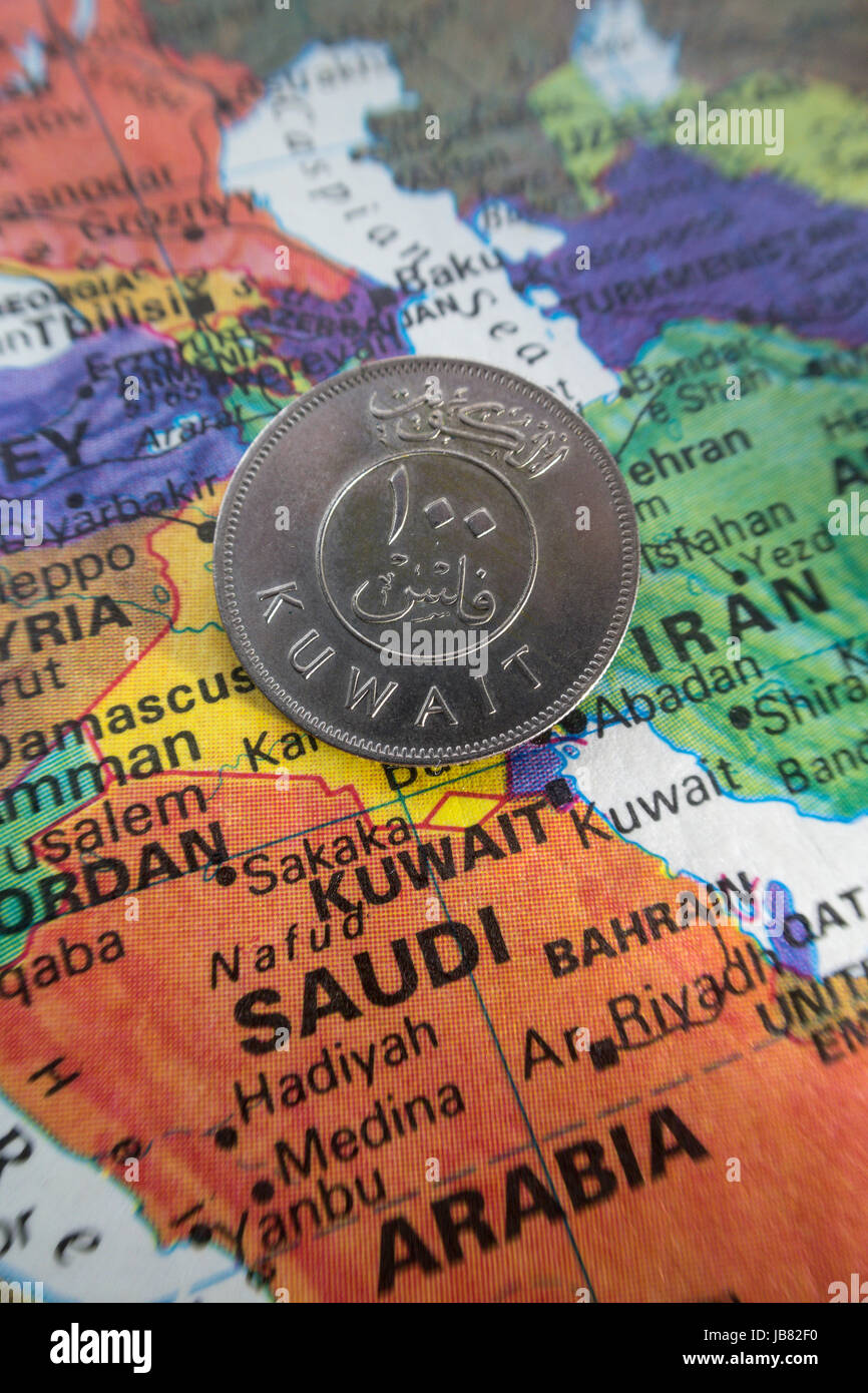 Kuwait Coin on World Map Still Life Stock Photo