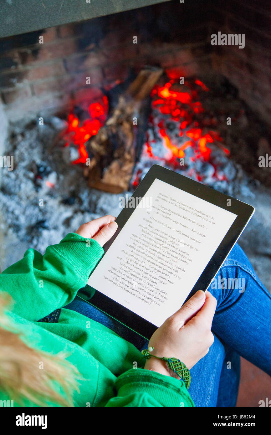Reading book on digital tablet Stock Photo