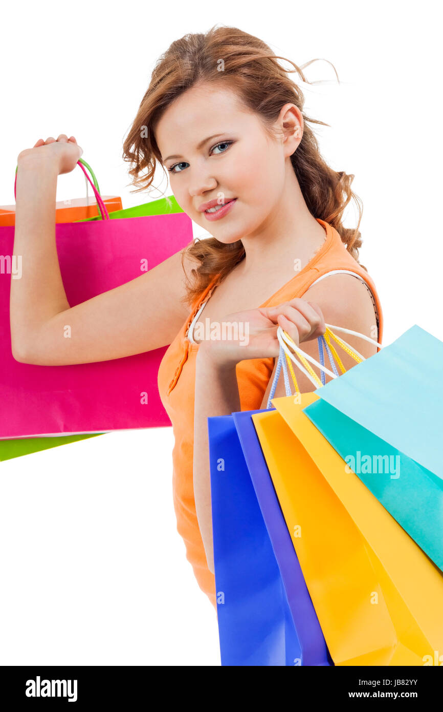junge lachende frau mit bunten einkaufstaschen shopping portrait isoliert Stock Photo