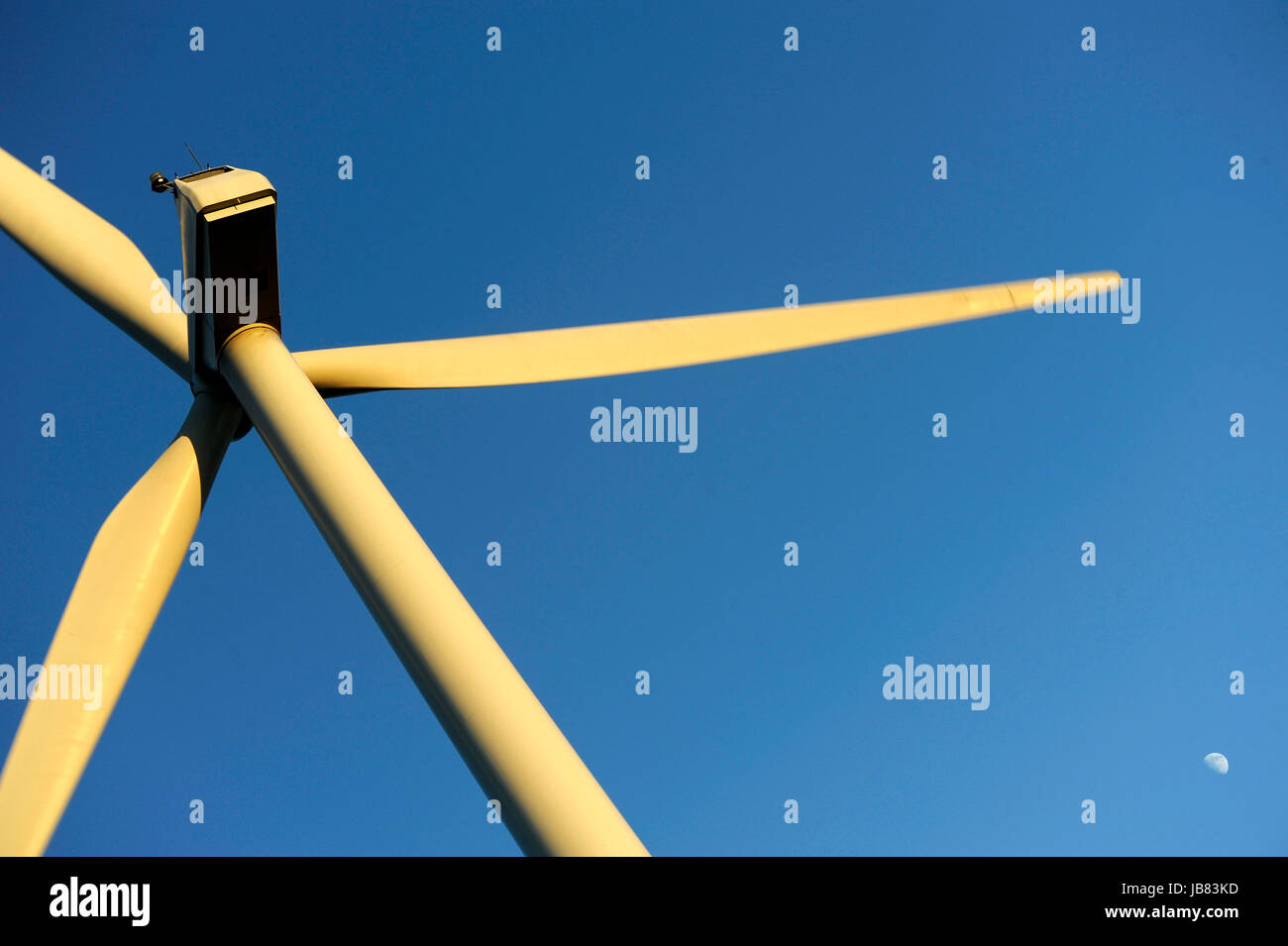 Wind turbine set against a clear blue winter sky Stock Photo - Alamy