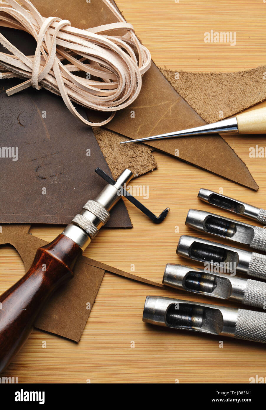 Tanner tools. Handmade Skiving knife and awl Stock Photo - Alamy