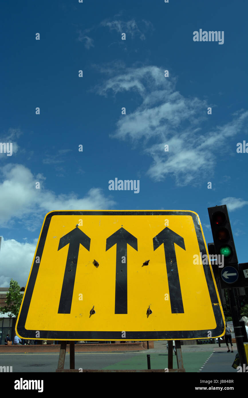 Diversion Sign At Roadworks With Three Black Arrows On Yellow, In Kingston  Upon Thames, Surrey, England Stock Photo - Alamy