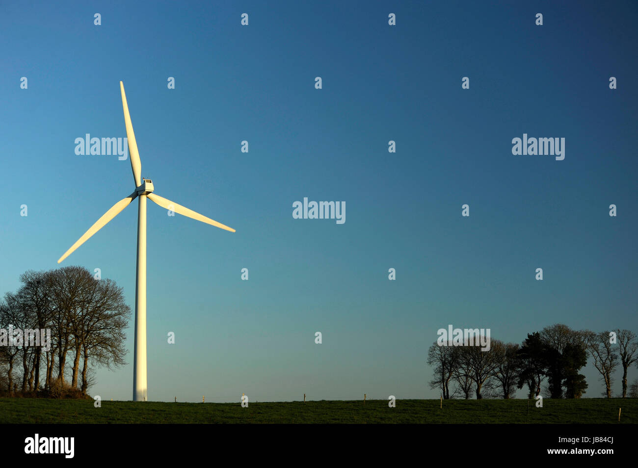 Wind turbine set against a clear blue winter sky Stock Photo - Alamy